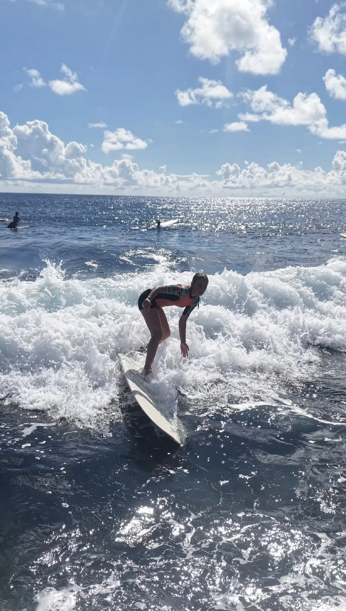 The coach riding a wave